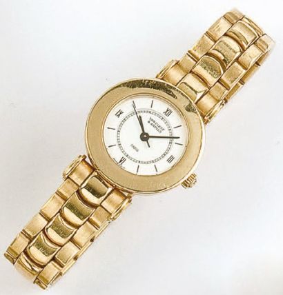 VAN CLEEF & ARPELS Bracelet montre de dame en or jaune, cadran blanc à chiffres romains,...