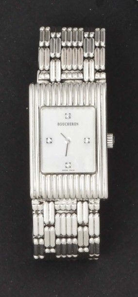 BOUCHERON »Reflet» - Bracelet montre de dame et acier.
Cadran gris, index diamants....