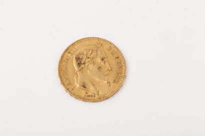 null Une pièce de 20 francs or, Napoléon III tête laurée, 1863.
P. 6,4 g.