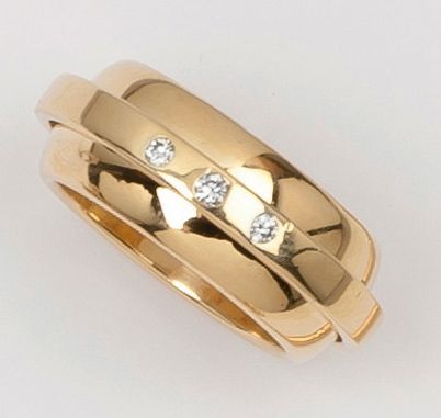 null PIAGET - Double anneau en or jaune dont, un, mobile serti de trois diamants...