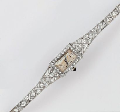 null Bracelet montre de dame en platine et or gris. Cadran blanc, chiffres arabes....