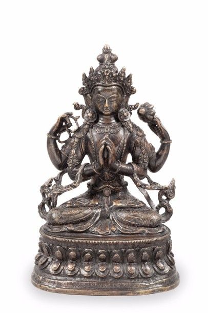 null Deux sujets en bronze, l’un représentant le Bouddha assis en médiation faisant...