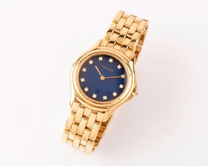 null CARTIER « Cougar » - Bracelet montre de dame en or jaune, cadran bleu avec index...