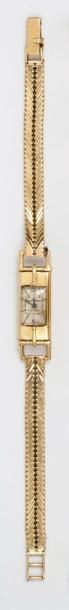 JAEGER LECOULTRE pour HERMES Bracelet montre de dame en or jaune. Cadran blanc, chiffres...