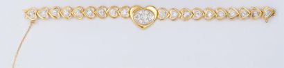 null Bracelet articulé en platine et or jaune à motifs de «Coeurs» dont un, au centre,...