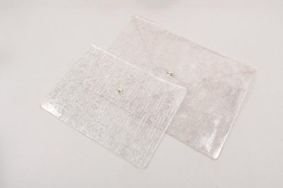 null Christian DIOR

Lot composé de deux pochettes 31cm, une 24cm en PVC transparent...