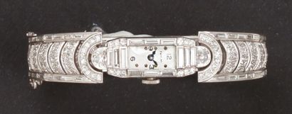 null TRABERT & HOFFER - MAUBOUSSIN - Bracelet -montre de dame ouvrant en platine....