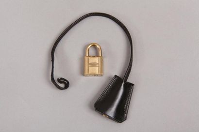 HERMES Paris *Clochette en box noir, clefs et cadenas en métal doré.