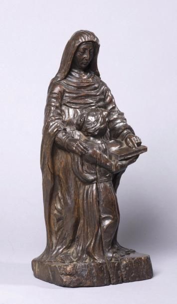 null Statue en bois sculpté (décapé) et patiné représentant
Ste Anne instruisant...