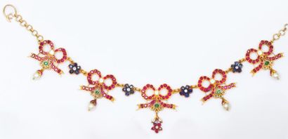 null Collier en or jaune orné de motifs» Noeud» et «Fleur» sertis de diamants taillés...