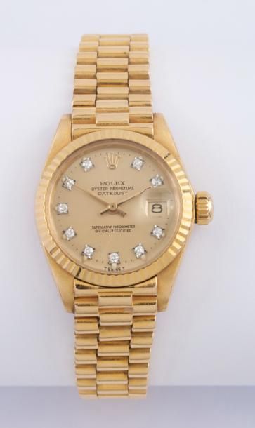 ROLEX-OYSTER PERPETUAL Montre bracelet de dame en or jaune.
Boitier rond. Couronne...