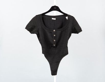 ALAÏA Lot composé d'un combi-short et d'une mini robe en maille noir ; nous y joignons...