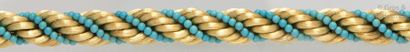 null Bracelet «Twist» en or jaune torsadé et boules de turquoise.
Longueur: 22cm....