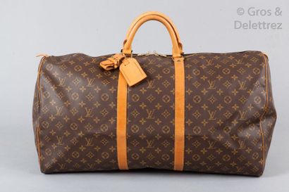 LOUIS VUITTON Sac " Keepall " 60cm en toile monogram et cuir naturel, fermeture éclair...