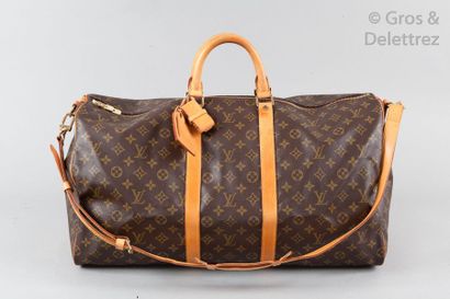 LOUIS VUITTON Sac " Keepall Bandoulière " 55cm en toile monogram et cuir naturel,...