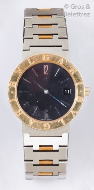 BULGARI «?Bulgari?» Bracelet-montre en or jaune et acier, cadran noir, date à trois...