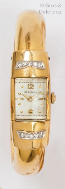BUCHERER Bracelet-montre de dame en or jaune, cadran rectangulaire bordé de diamants...