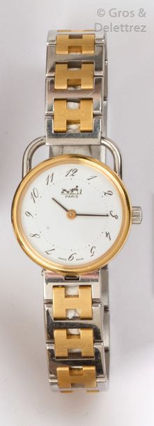 HERMES «?Arceau?» - Bracelet-montre de dame en acier et acier doré, boîtier rond,...