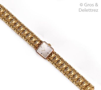 ZENITH Bracelet-montre de dame en or jaune. Boîtier carré, cadran nacré avec index...