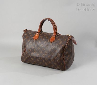 LOUIS VUITTON Sac "Speedy" 30cm en toile Monogram et cuir naturel, fermeture éclair,...