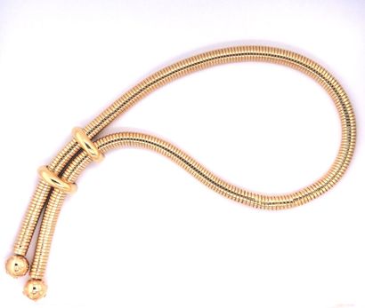 null COLLIER souple tubogaz en or (750) terminé par deux boules et transformable...