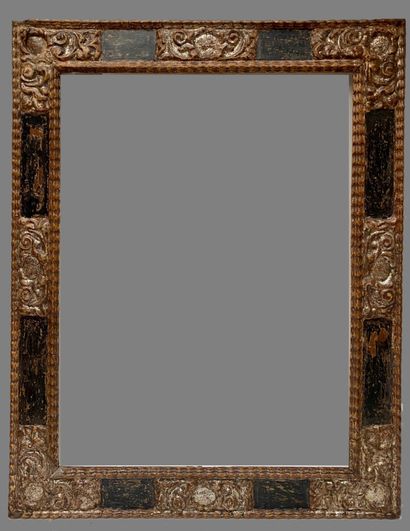 null Cassetta" frame in blackened and silvered wood with reserves in the corners...