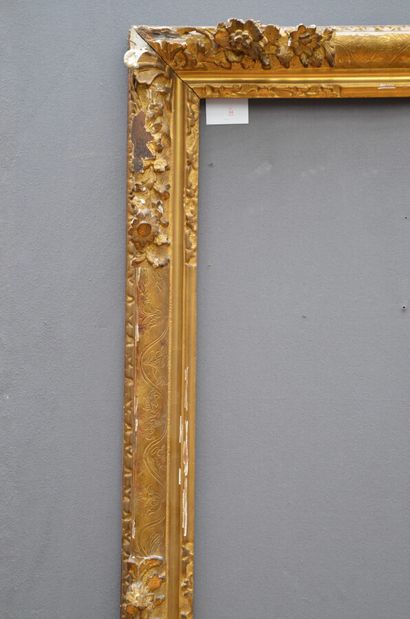 null Large carved and gilded oak FRAME decorated with a frieze of water leaves, garland...