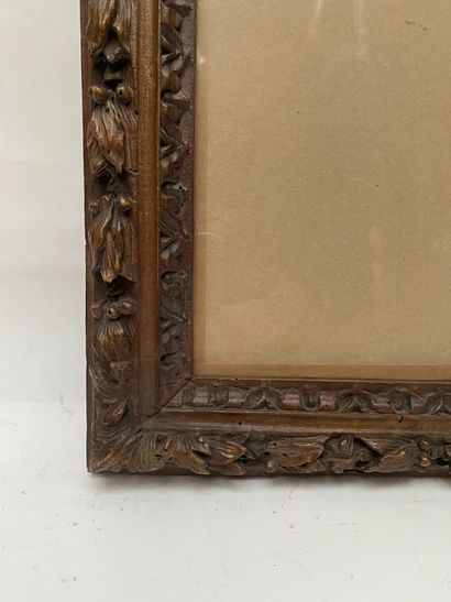 null FRAME in fruit wood, waxed and carved with a frieze of water leaves and laurel...