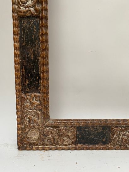 null Cassetta" frame in blackened and silvered wood with reserves in the corners...