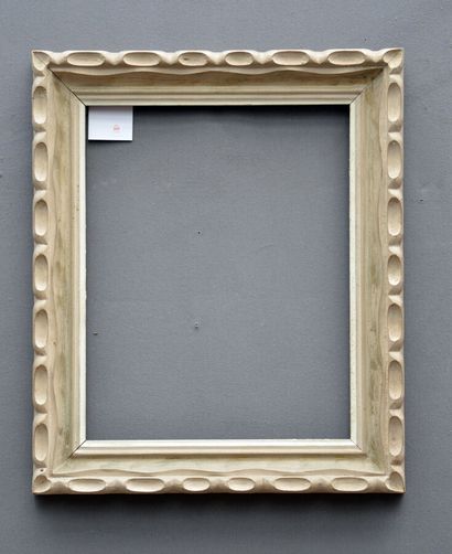 null FRAME in carved moulded wood with a grey and white rechampi with a stylized...