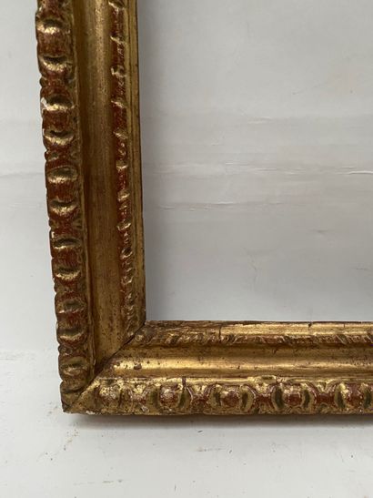 null Carved and gilded wood frame with twisted ribbon decoration and frieze of gadroons....