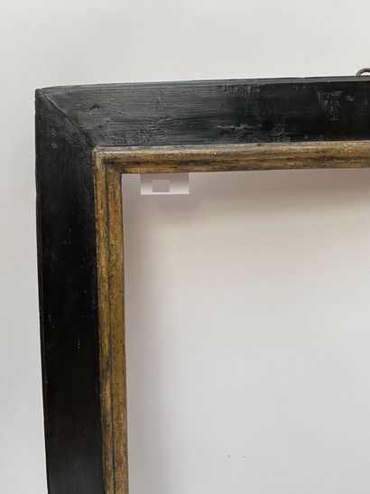 null Cassetta" frame with upside down profile in blackened and gilded wood 

Spain,...