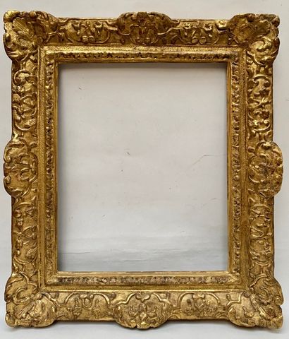 carved and gilded oak frame with Bérain decoration,...
