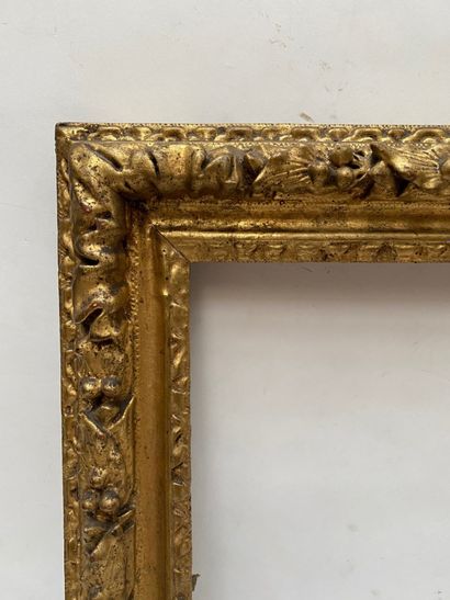 null carved and gilded oak frame with friezes of water leaves and laurel twists 

Louis...