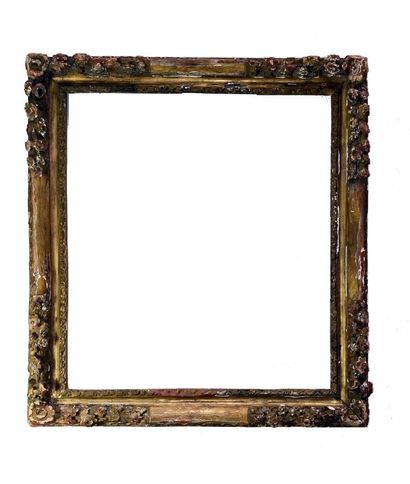 null Gilded beechwood frame carved with garlands of flowers in the corners centered...