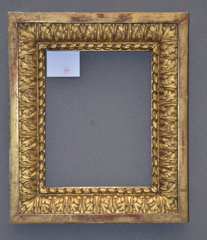 null Carved and gilded oak frame with a frieze of twisted ribbons and oak leaves.

Louis...