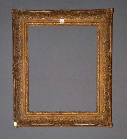 null Carved and gilded wood frame with Bérain decoration, water leaves, sand background....