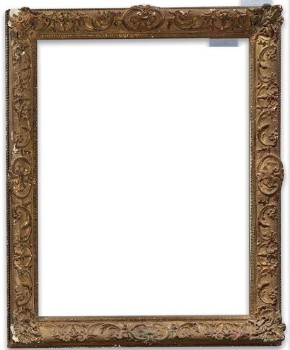 null Gilded wood and stucco frame in the Louis XV style (small manques with a glass)

61...