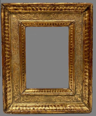 null Moulded, carved and gilded wood frame with Cassetta decoration in foliated scrolls...