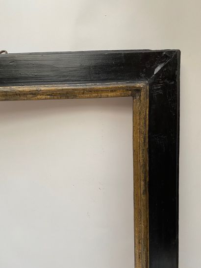 null Cassetta" frame with upside down profile in blackened and gilded wood 

Spain,...