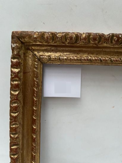 null Carved and gilded wood frame with twisted ribbon decoration and frieze of gadroons....