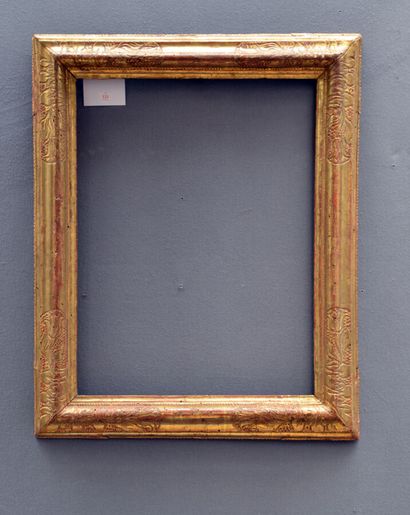 null Reverse profile carved and gilded wood frame with carved and gilded decoration...