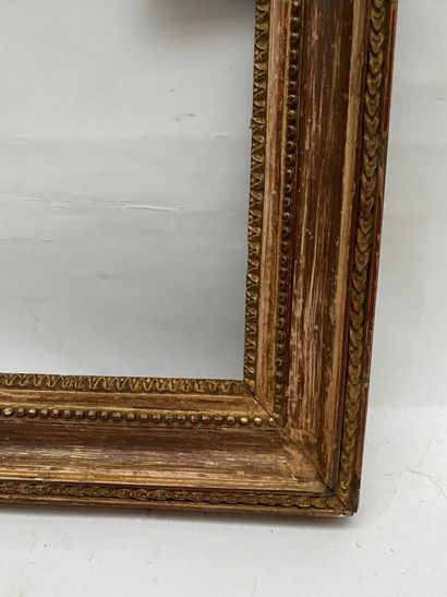 null carved oak frame, gilded with raise-de-coeur decoration, pearl friezes and posts

Louis...