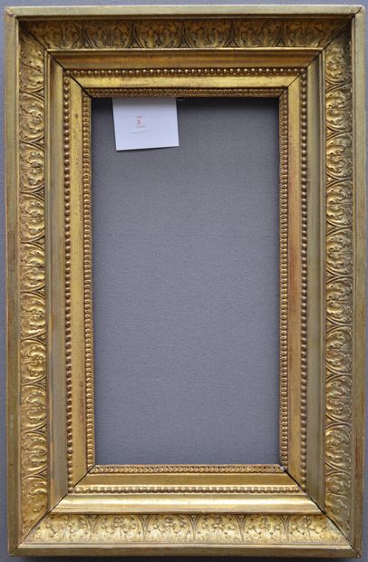 Carved and gilded oak frame with raise-de-coeur...