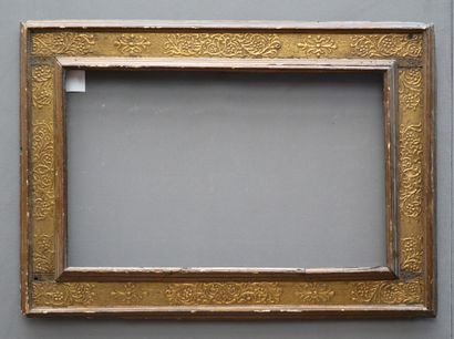 null Large upside down profile FRAME in moulded and gilded wood with foliated scroll...