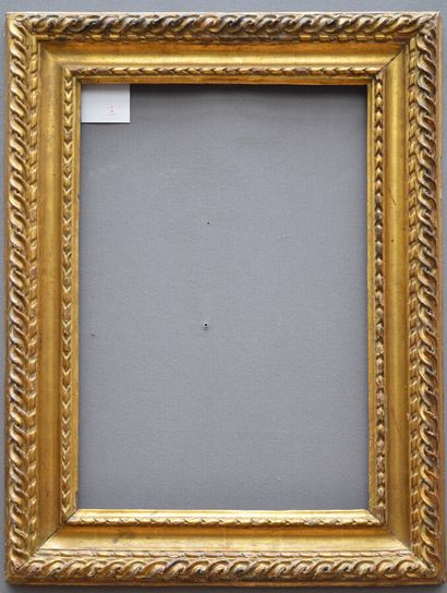 null Carved and gilded oak frame decorated with laurel twists, twisted ribbons and...