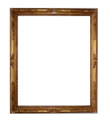 null FRAME out of carved and gilded wood with decoration of rinceaux, flowers, staples...