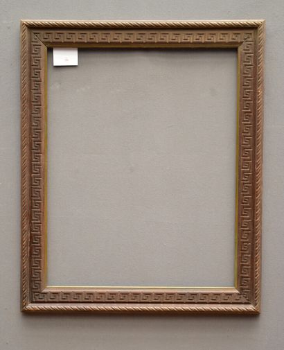 null Carved and waxed wood frame with Greek-style frieze decoration and twisted ribbons.

Beginning...