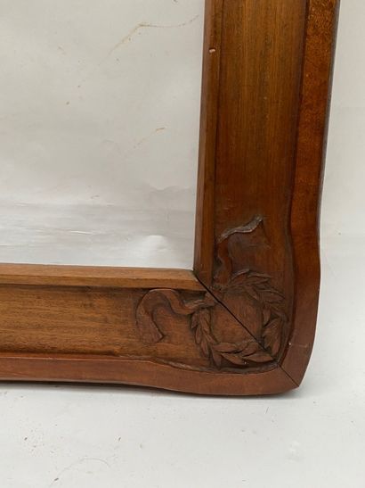 null Flat-grooved walnut frame with laurel wreaths in the corners 

Early 20th century...