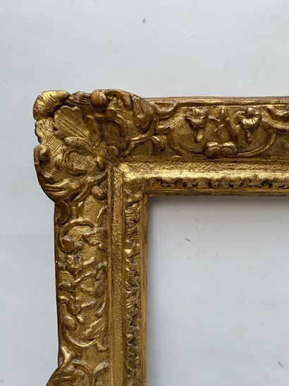null carved and gilded oak frame with Bérain decoration, shells in the corners and...